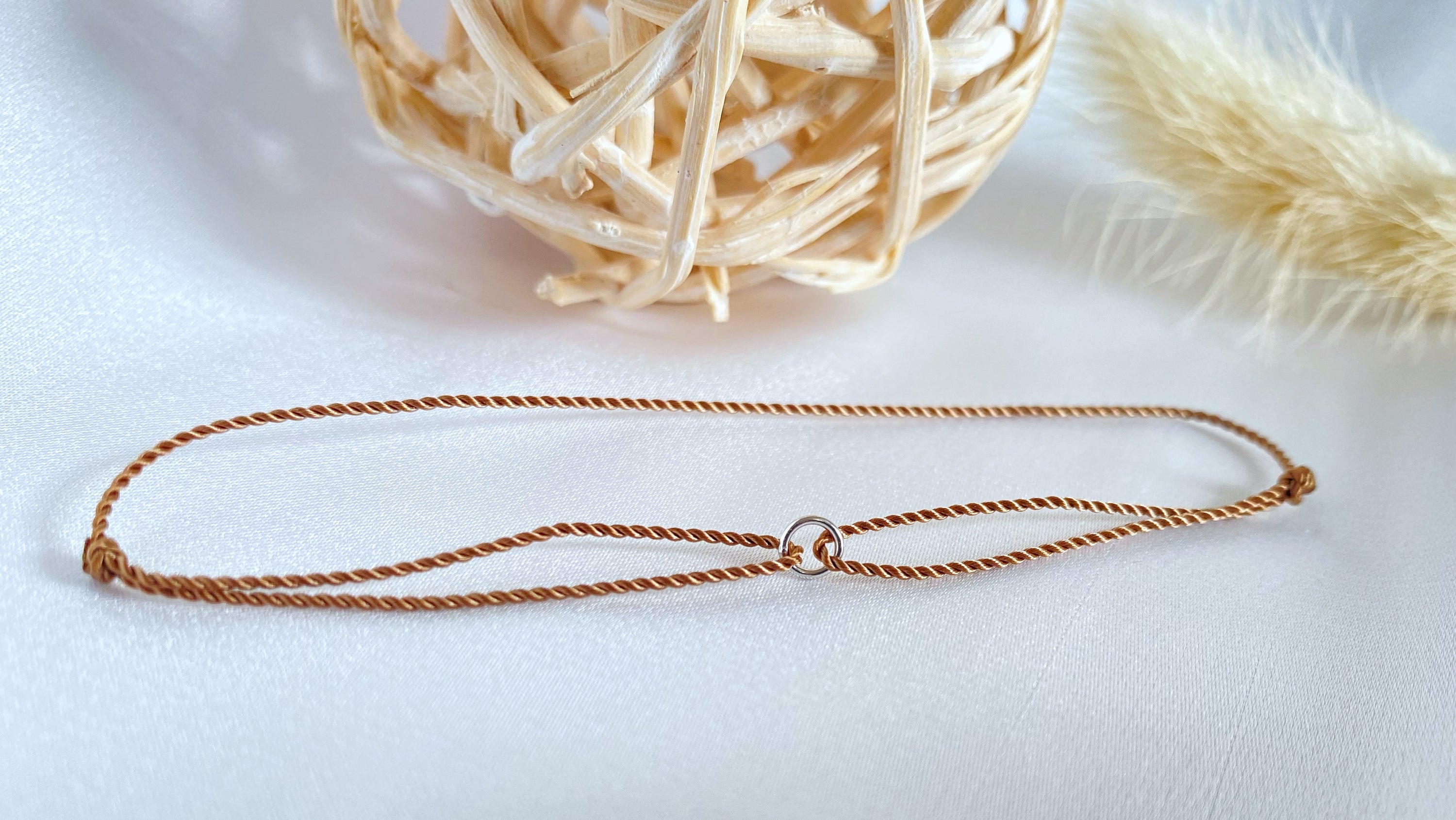 White gold karma bracelet