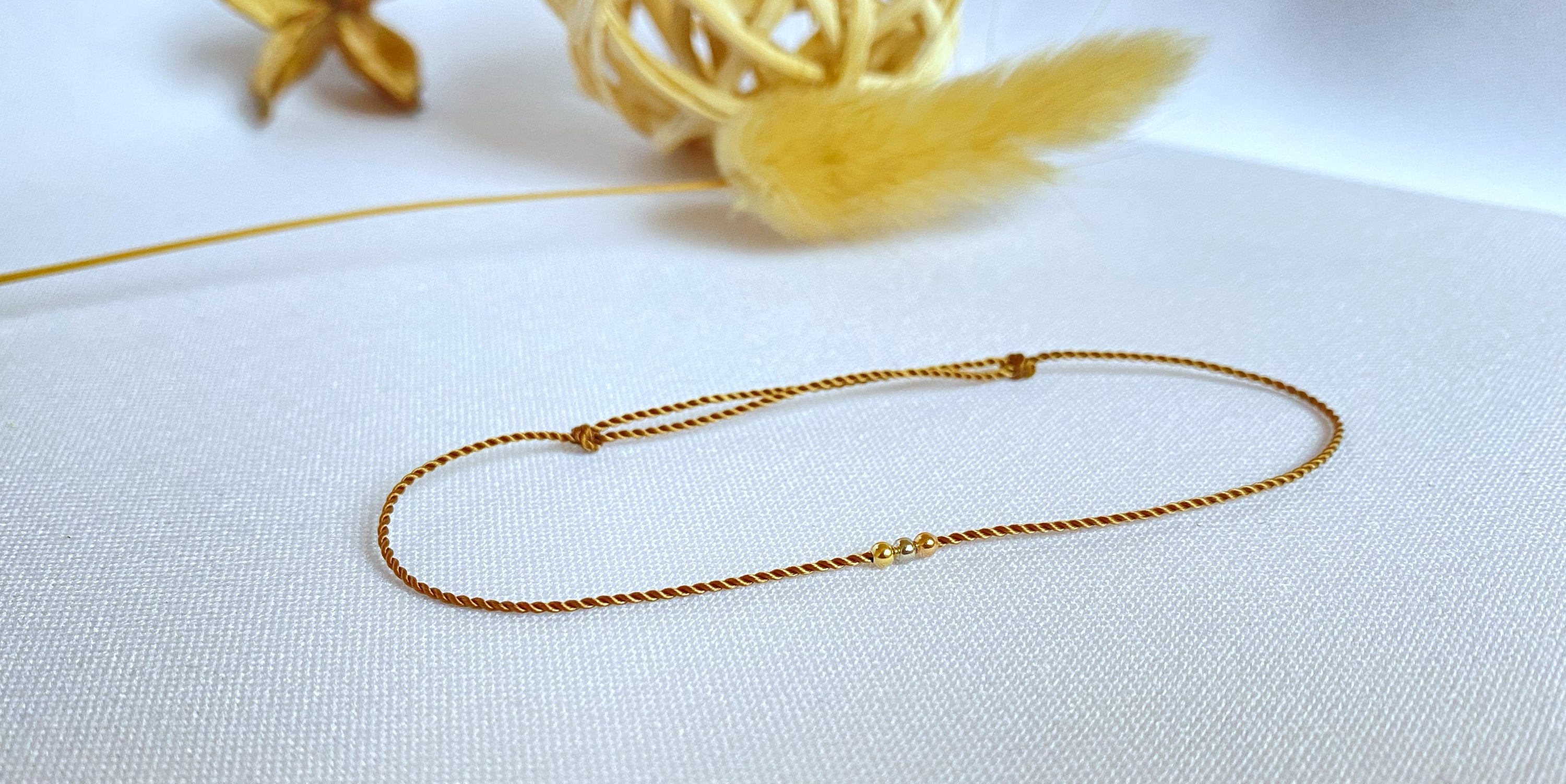 Mix aus drei Goldperlen-Armbändern